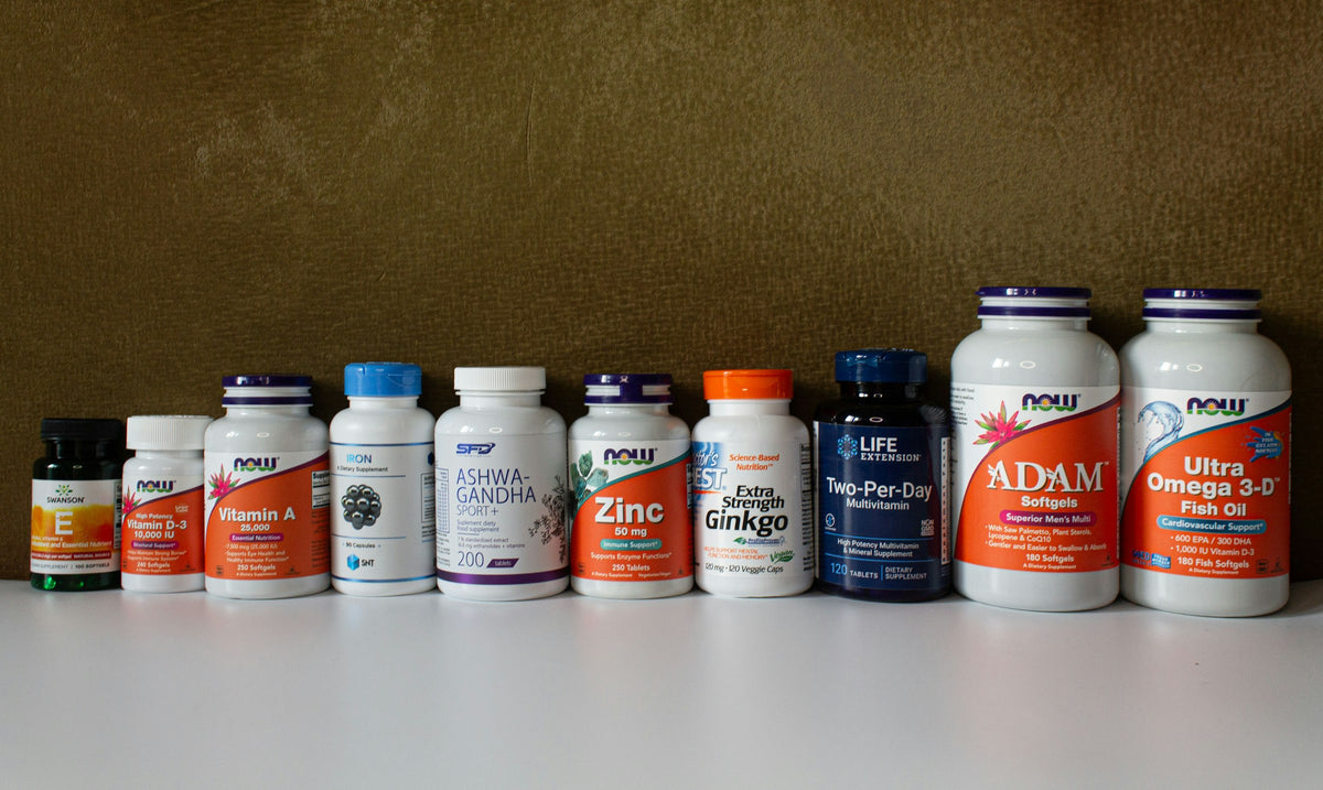 A row of supplement bottles on a shelf