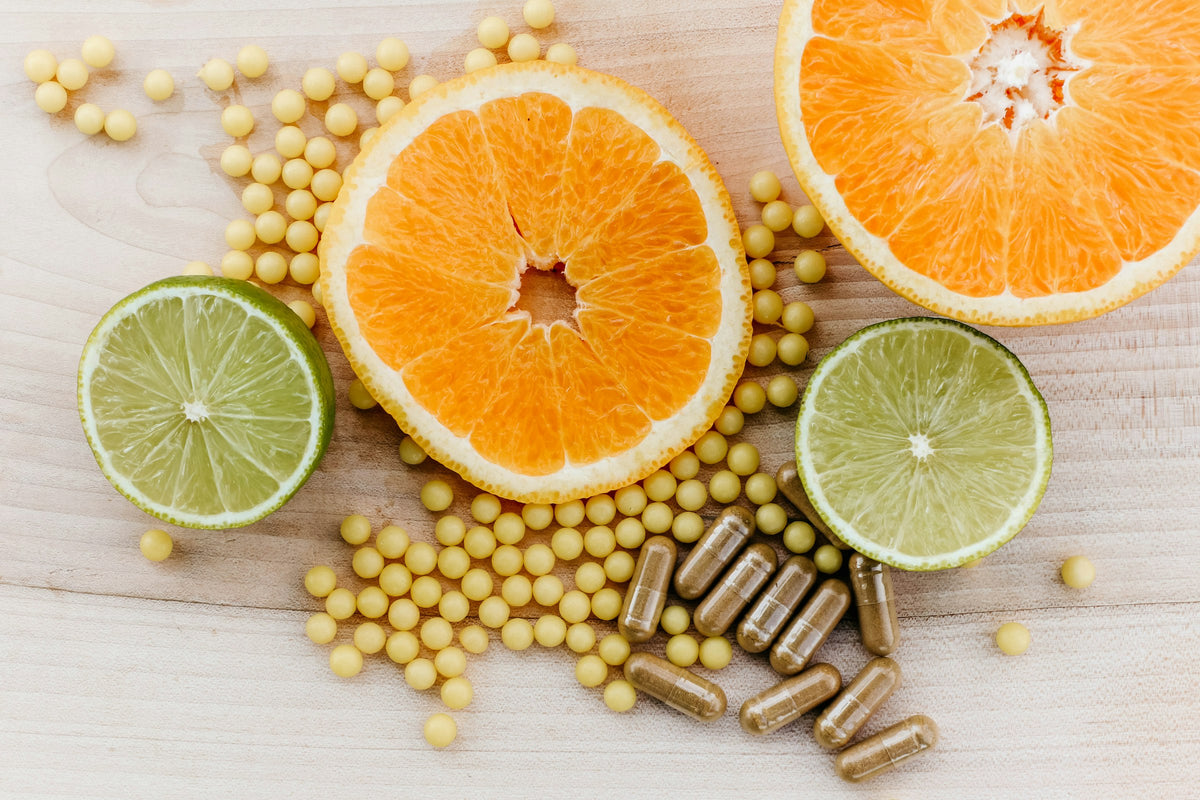 Supplement softgels with sliced citrus fruit