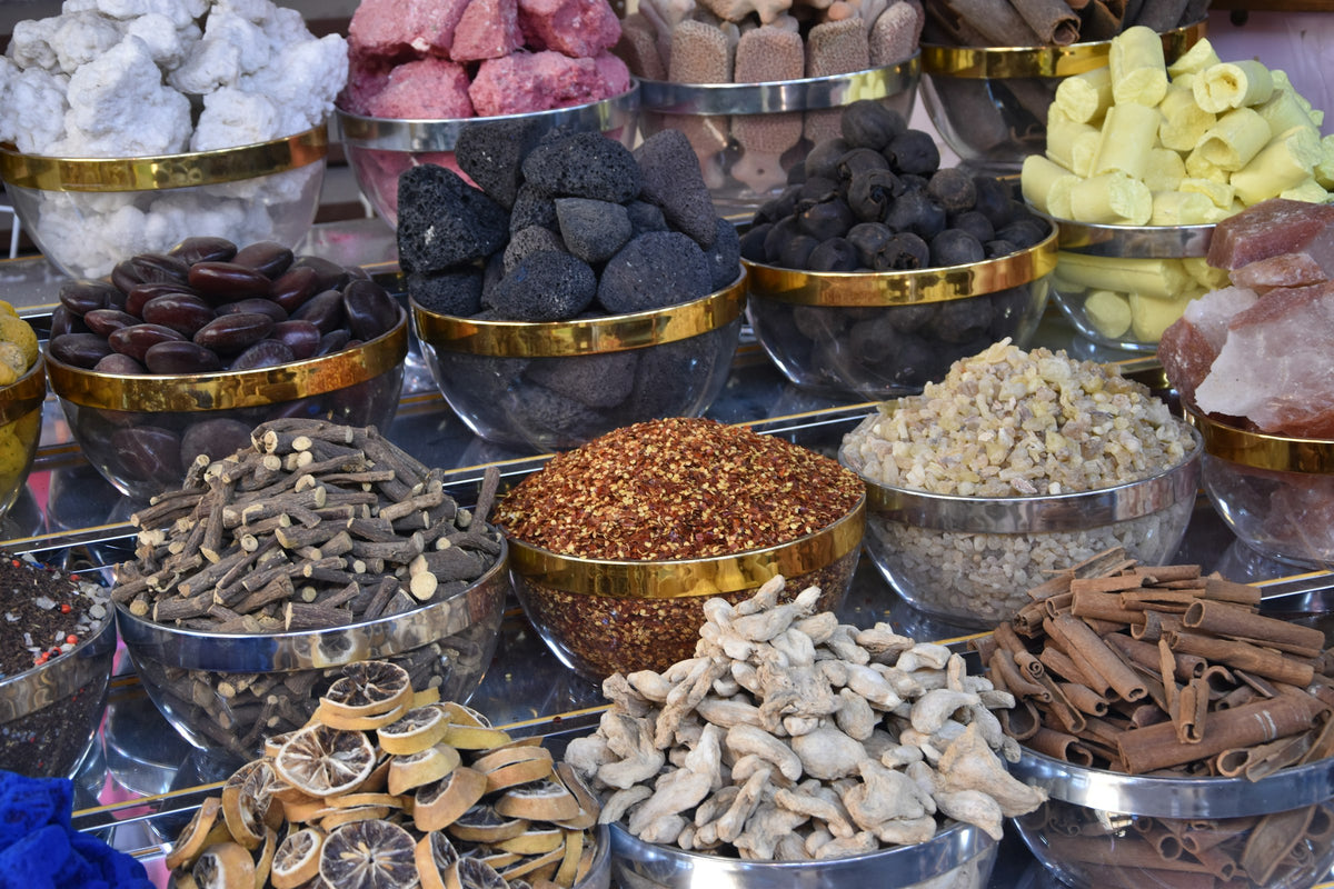 Bowls of colorful spices and dried goods at a market